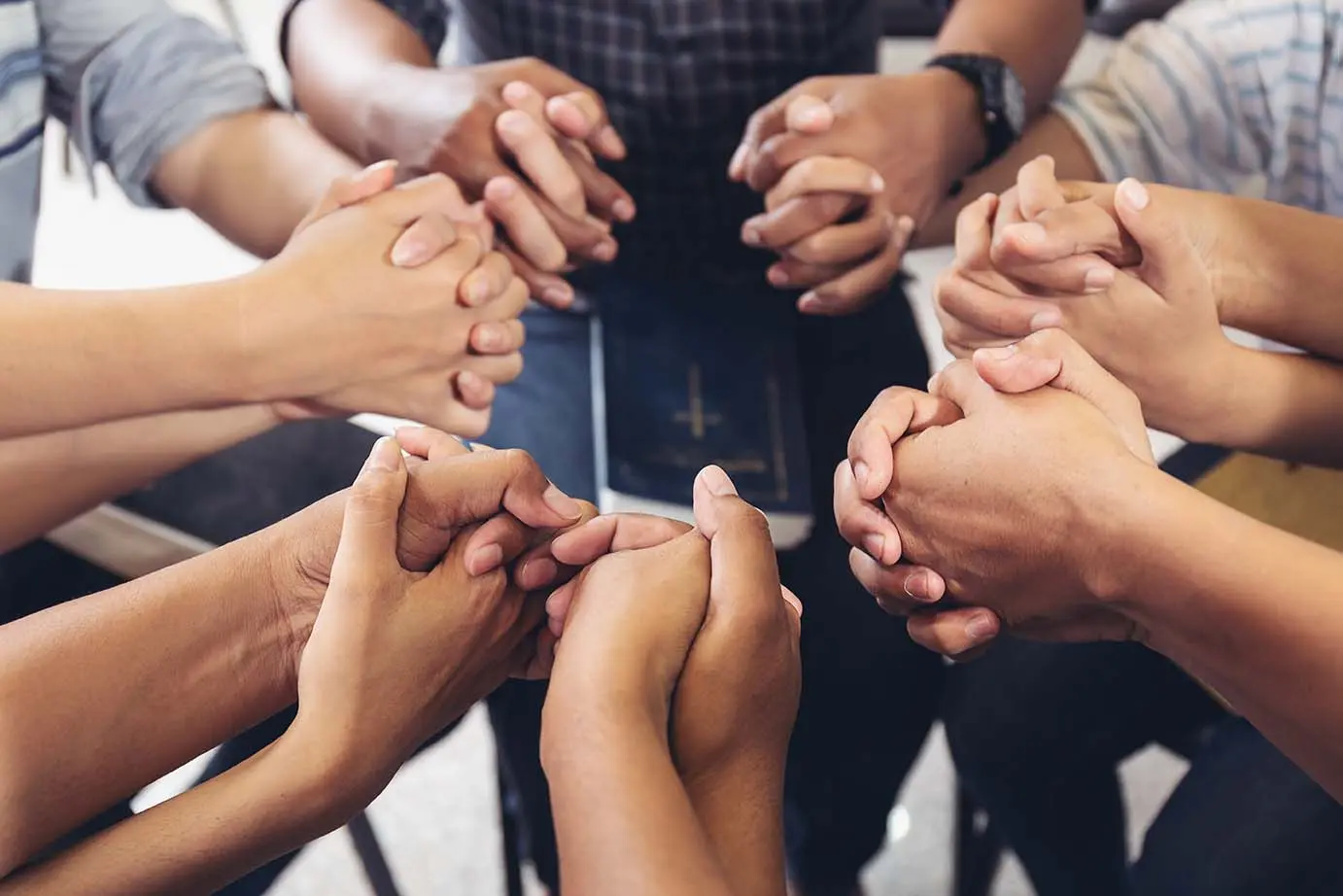 Men supporting one another in recovery at Nadezhda Houses of Hope, Charlotte, NC